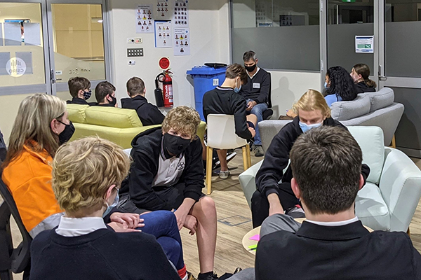 Pictured above: InfraBuild mentors in discussion with participating Year 9 and 10 students